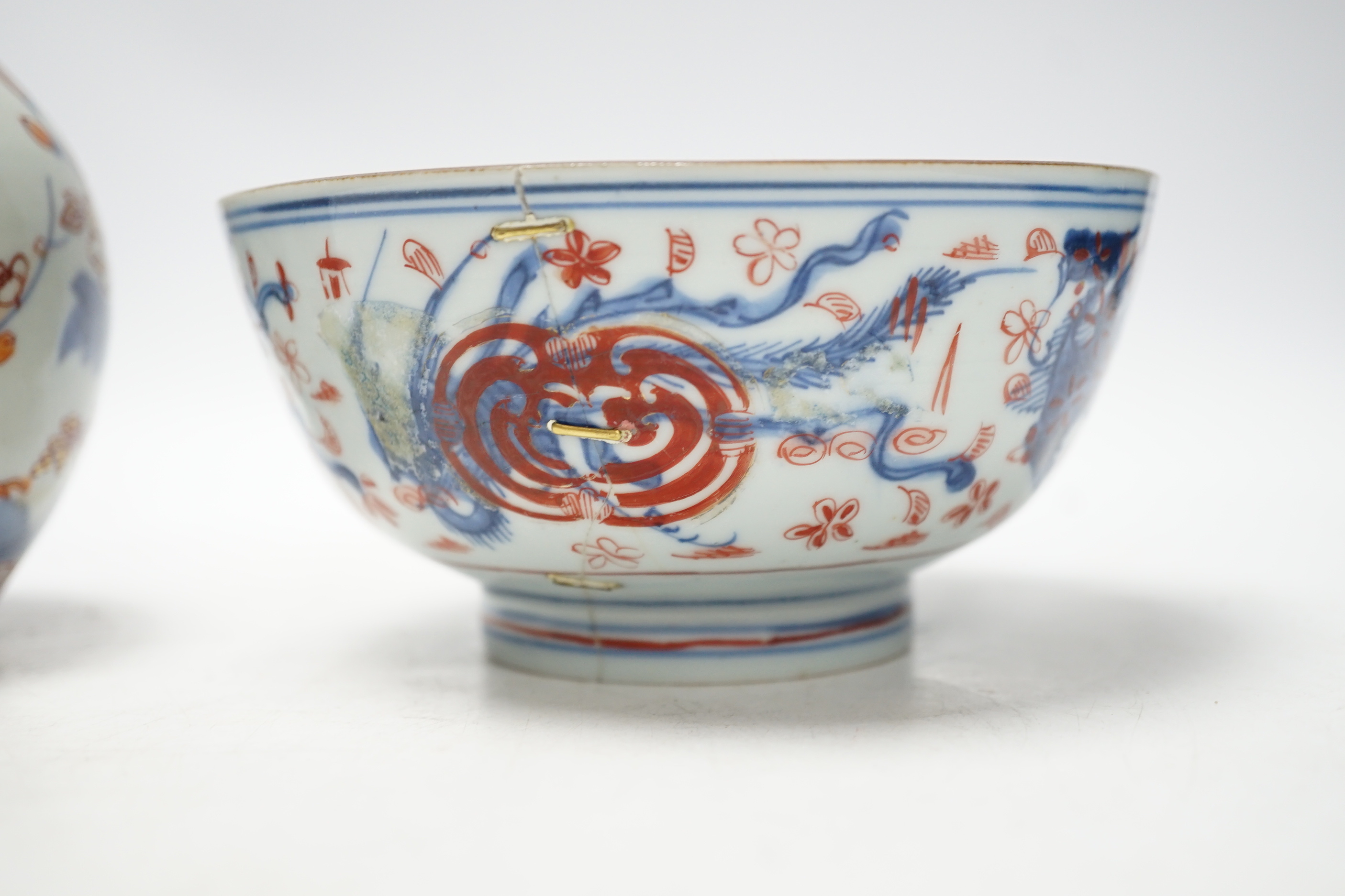 An 18th century Japanese Imari sake flask and a Chinese clobbered blue and white bowl (a.f), tallest 20cm